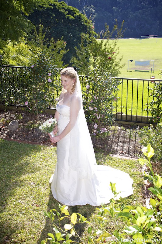 Full length photo of bride in her parents garden pre wedding - wedding photography sydney